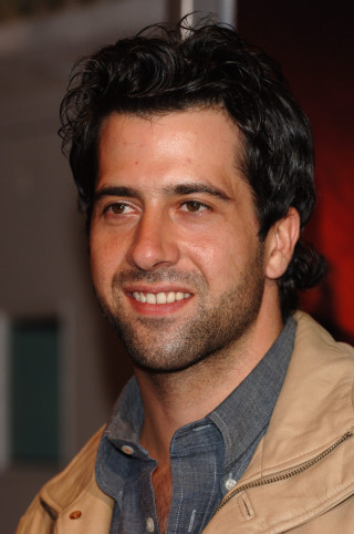 Bearded man smiling red background 2 - david lazar free wallpaper for mobile