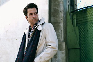 Man standing building scarf jacket - his shoulder free wallpaper