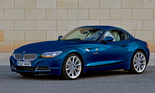 Blue bmw z4 parked brick - a brick wall behind free wallpaper