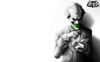 Creepy man green makeup holding - a batman logo free wallpaper