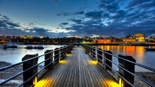 Wooden pier metal railing city - a metal free wallpaper