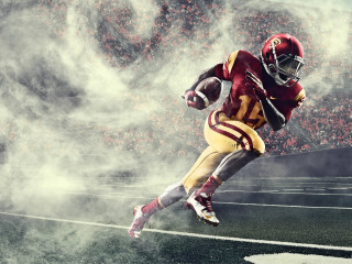 Football player running smoke crowd 2 - a football player free wallpaper