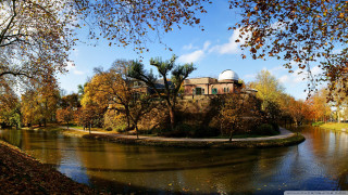 River park building trees foreground - the other side of it free wallpaper