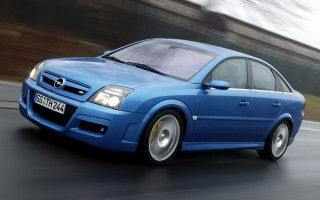 Blue car driving street forest 2 - a blue car free wallpaper for desktop