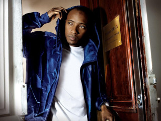 Man blue jacket leaning door - chafik charobim free wallpaper for desktop