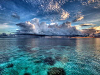 Large body water cloudy sky - a large body of water under a cloudy sky free wallpaper