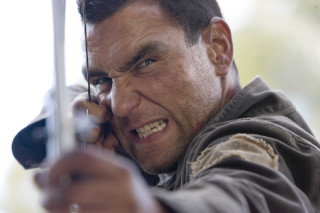 Man holding phone smiling camera - his ear free wallpaper