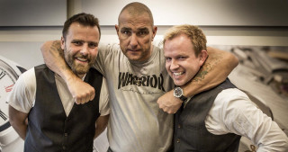 Two men hugging clock tower - a bald man free wallpaper for desktop