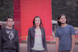 Three people red building red - a red wall behind them free wallpaper