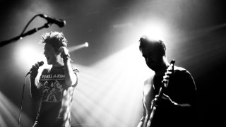 Man microphone stage speaking performance - deep shadow free wallpaper