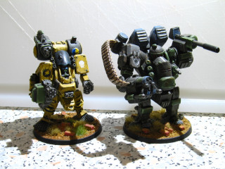 Warhammers guns armor tabletop white - a white wall behind them free wallpaper