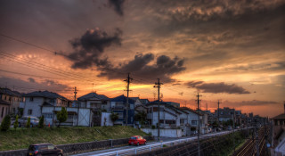 Red car street buildings sunset - a street next free wallpaper