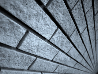 Brick wall concrete top photorealism - a close up of a wall free wallpaper