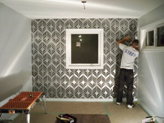 Man painting wallpaper window op - fine detail free wallpaper