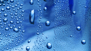 Water droplets blue surface sky - a close up of water droplets free wallpaper