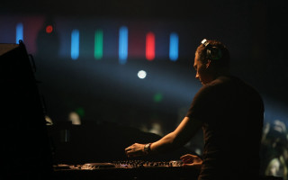 Man sitting keyboard stage light - neon free wallpaper for desktop