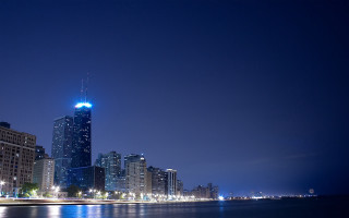 City skyline night water skyscraper - a large body of water in front free wallpaper