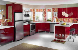 Kitchen red cabinets silver refrigerator - a bowl of fruit free wallpaper