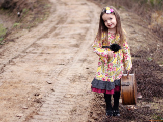Little girl suitcase smiling dirt - a little girl holding free wallpaper