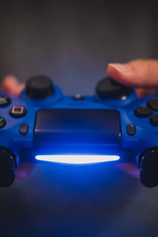 Person holding blue controller light - akihiko yoshida free wallpaper for mobile
