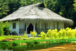 Thatched hut river bridge trees - a hut free wallpaper for desktop