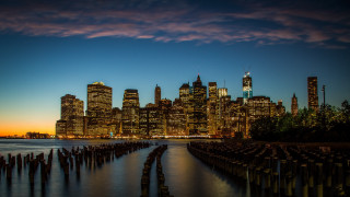 City skyline night water wooden - a body of water in front free wallpaper for desktop
