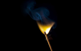 Matchstick yellow flame dark smoke - a yellow flame free wallpaper
