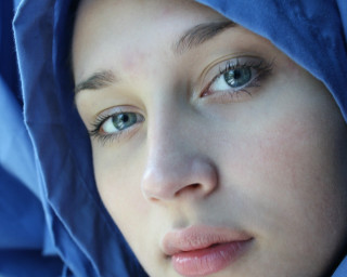 Woman blue head scarf cell - her hand and a cell phone free wallpaper