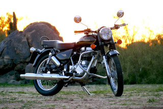 Motorcycle parked field rock sunset - a bright light free wallpaper for desktop