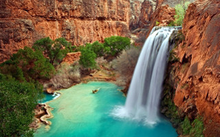 Waterfall blue pool man boat - a blue pool in the middle of it free wallpaper