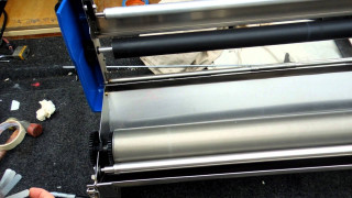 Person cutting paper scissors machine - cutting free wallpaper