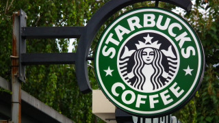 Starbucks sign building trees background - photorealistic imagery free wallpaper