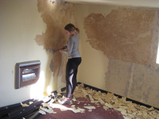 Woman painting wall paint roller 2 - liminal space free wallpaper