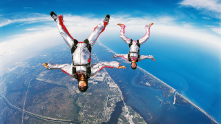 Skydiving white suits arms out - foot free wallpaper
