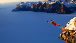 Man jumping cliff water snowboard - extreme free wallpaper