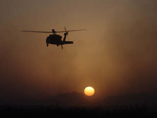 Helicopter sunset mountain flying sky - a helicopter free wallpaper for desktop
