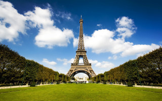 Tall tower lush green field - paris school free wallpaper