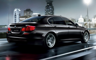 Black car city street night - the background and a city skyline free wallpaper