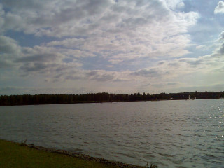 Lake boats clouds grassy shore - correggio free wallpaper