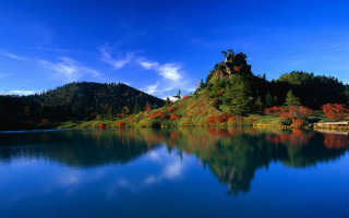 Lake mountain trees blue sky 6 - a mountain in the background and trees free wallpaper for desktop
