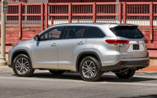 Silver suv parked road fence - a silver suv free wallpaper