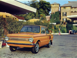 Orange car parked road building - an orange car free wallpaper