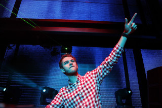 Man checkered shirt hand up - a stage free wallpaper for desktop