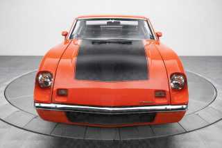 Orange sports car circular display - a black floor free wallpaper for desktop