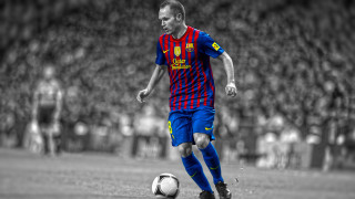 Man soccer player kicking ball - a crowd in the background free wallpaper