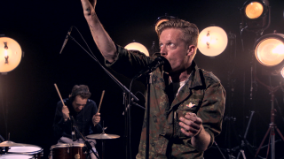 Military man singing microphone drums - a man in a military uniform free wallpaper