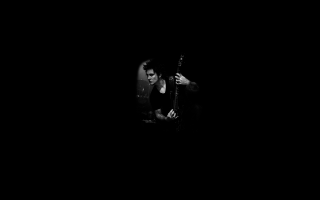 Man playing guitar dark background - a man playing free wallpaper