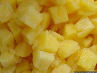 Pile cut up pineapples table - fructose free wallpaper