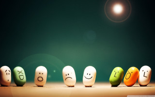 Painted eggs with faces row - expressive free wallpaper for desktop