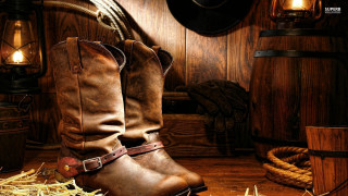 Cowboy boots hay barrel rope - top of a pile free wallpaper